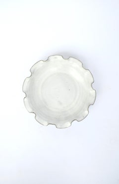 White Pottery Bowl with Ruffled Edge