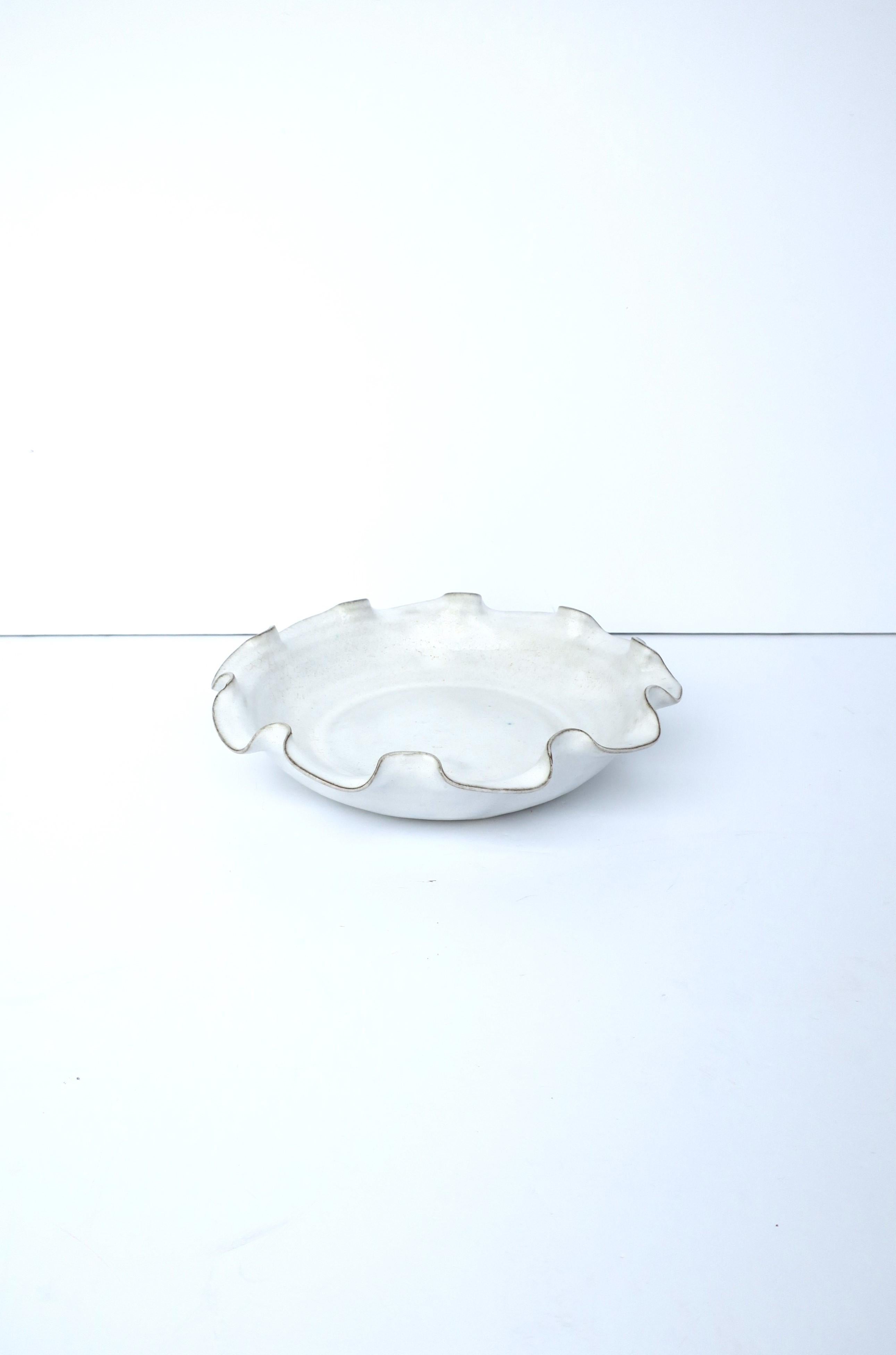 Glazed White Pottery Bowl with Ruffled Edge For Sale