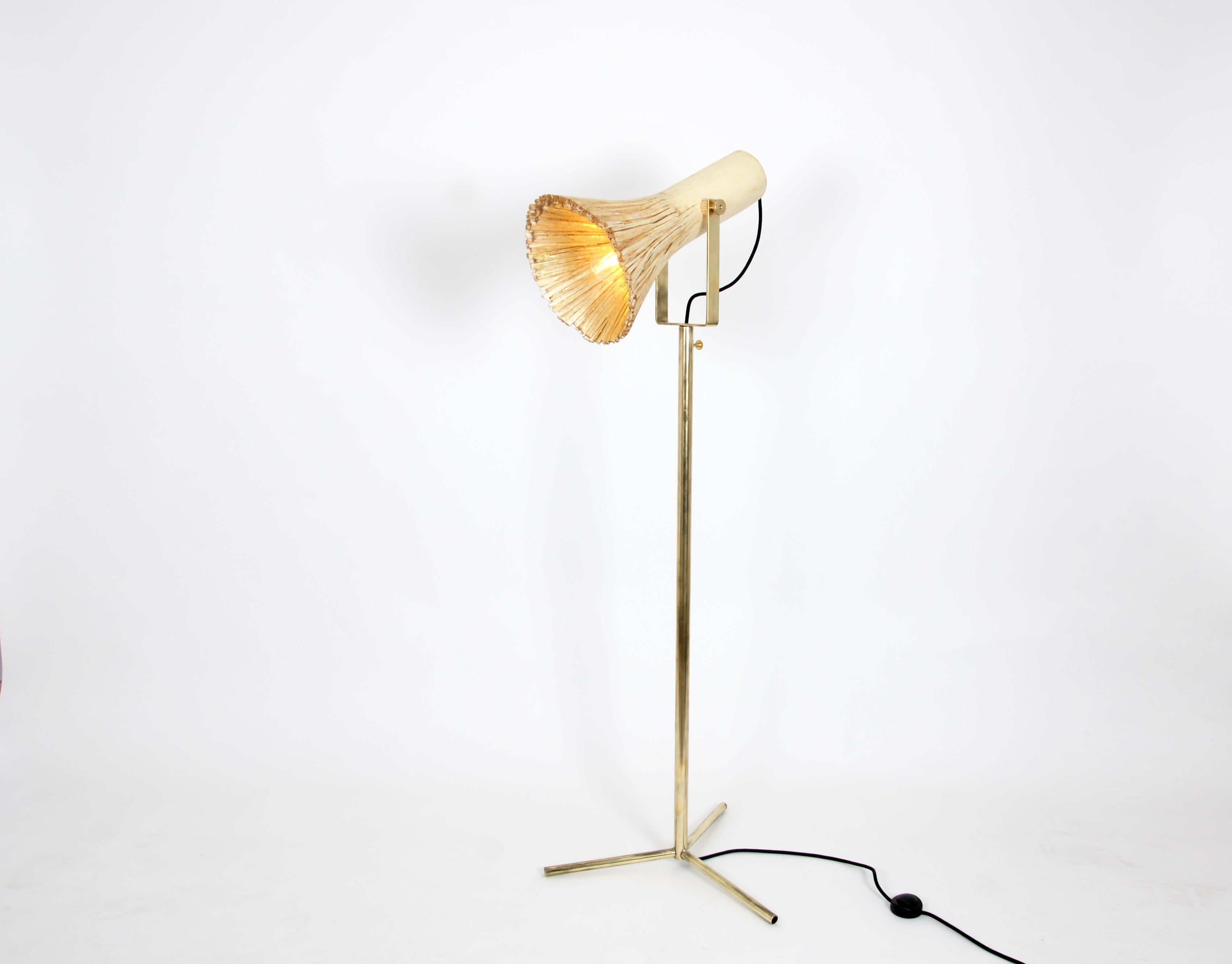 Black pressed wood floor lamp by Johannes Hemann
Materials: Wood, brass
Dimensions: Height 130cm, Ø 35cm

The series 