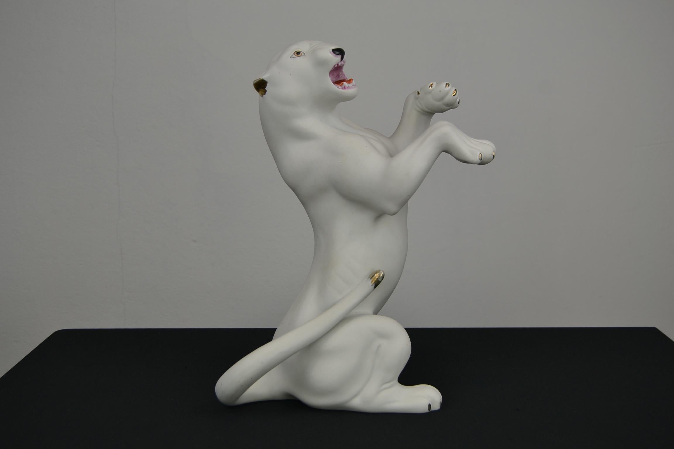 white porcelain dog statue