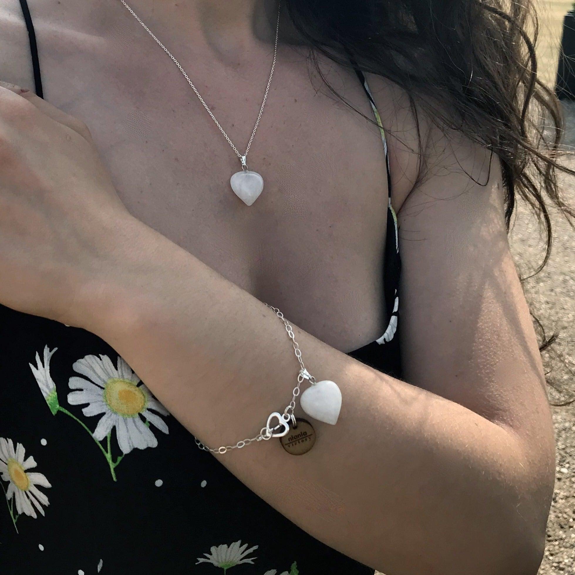 Indulge in the purity and elegance of our White Quartz Bracelet, featuring a stunning Sterling Silver Heart Charm Bracelet. Each bead is hand-picked for its unique beauty and quality. The white quartz is a symbol of clarity and positivity, with