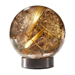 Sphère éblouissante en quartz avec rutile doré