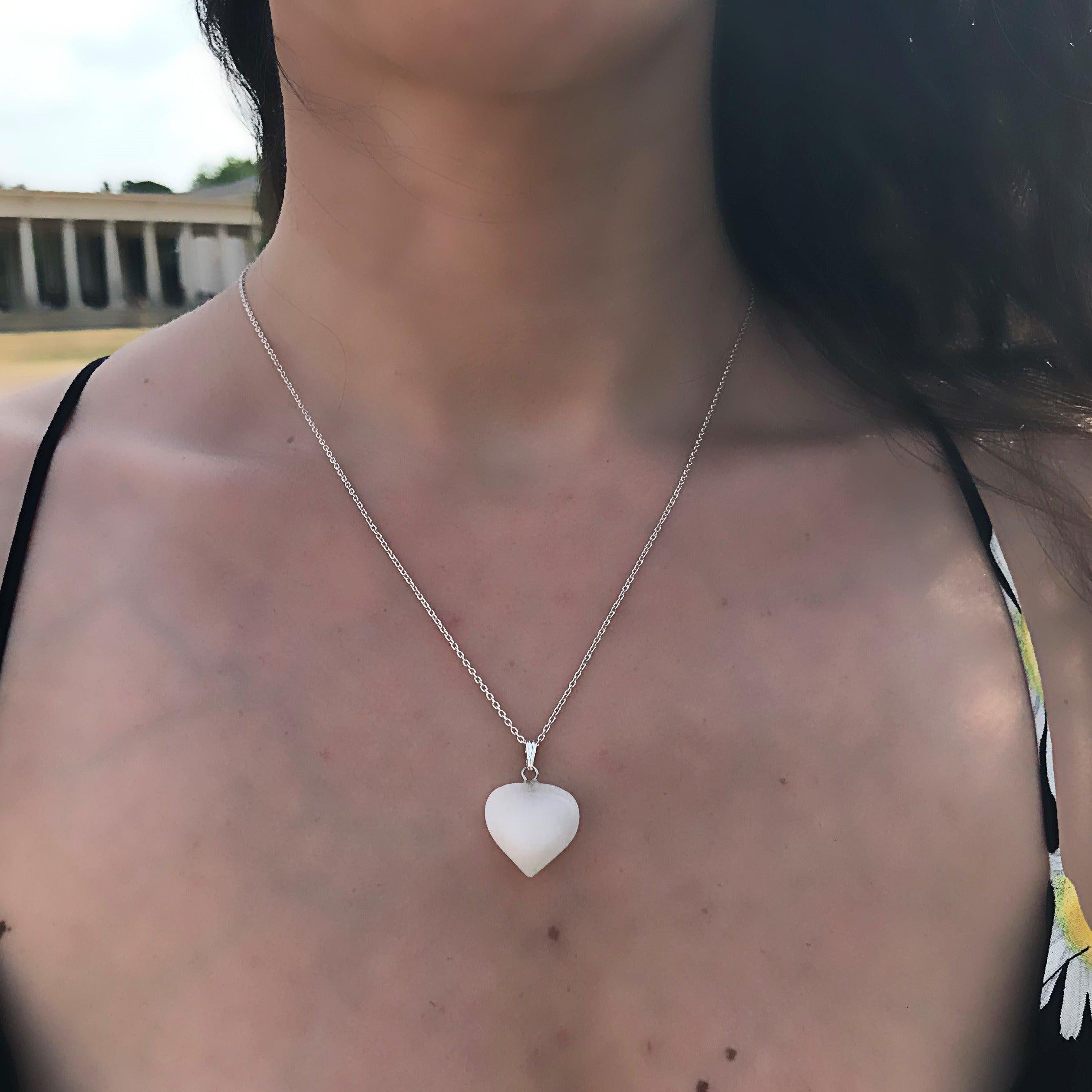 This stunning White Quartz Sterling Silver Necklace features a beautifully crafted heart pendant made of sterling silver and a white quartz gemstone. The delicate chain is made of high-quality sterling silver, which adds to the elegance of this