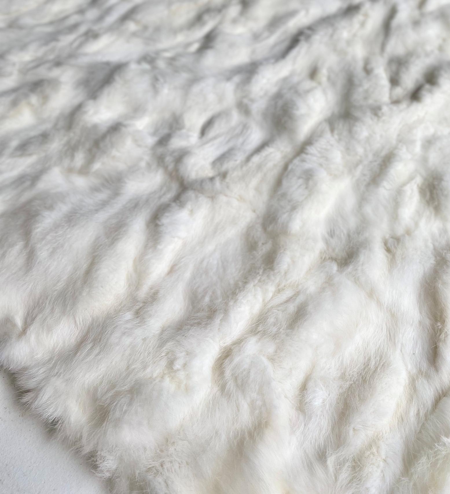 This ever so luxurious white fur blanket injects regal aesthetic to any master bedroom and suite. With soothing and irresistibly soft pile invites comfort with an elegant design full of poise. Intricately crafted from genuine rabbit fur, the white