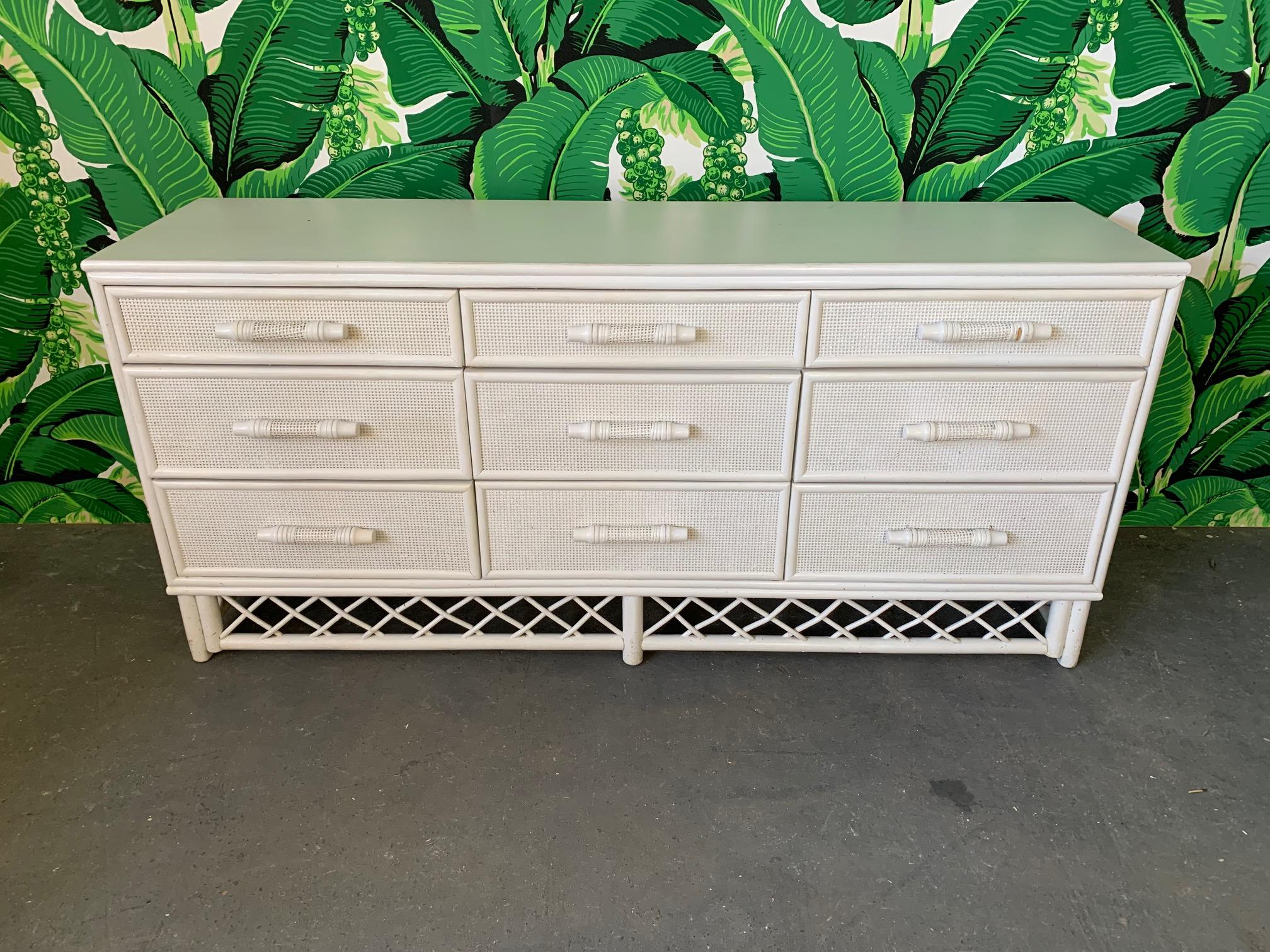 White rattan dresser features chinoiserie detailing and a rattan lattice design skirt. Good vintage condition with minor imperfections consistent with age.