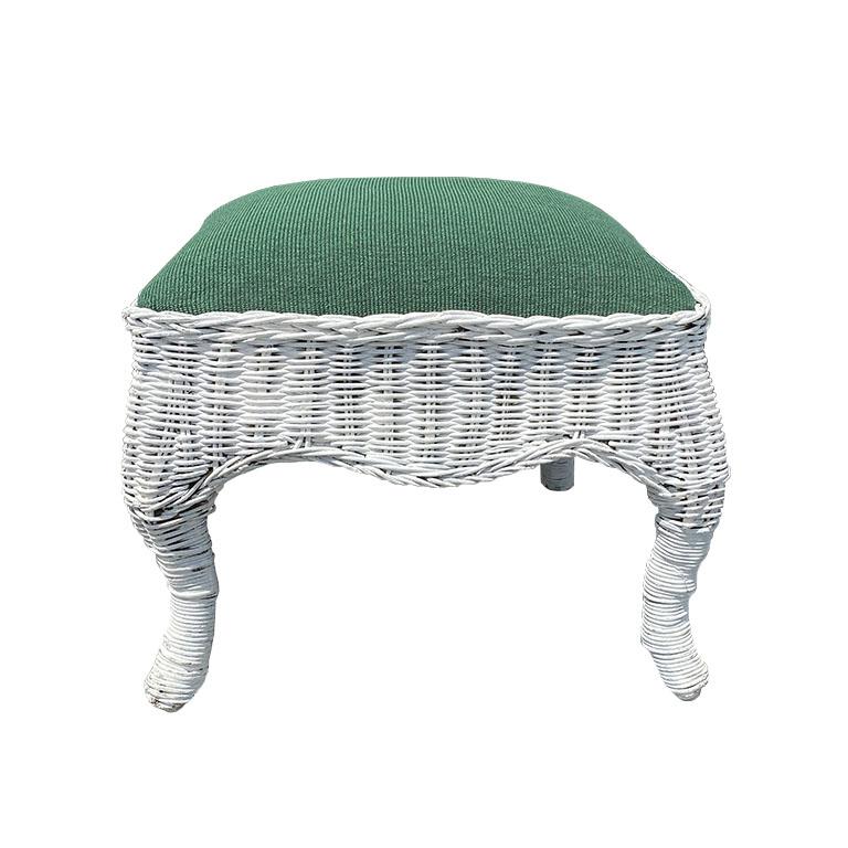 A white-painted wicker footrest with a green upholstered top. This small wicker stool will be great as an accent piece in any space. It has a Trompe L'oeil skirt, and splayed legs. 


Dimensions:
13