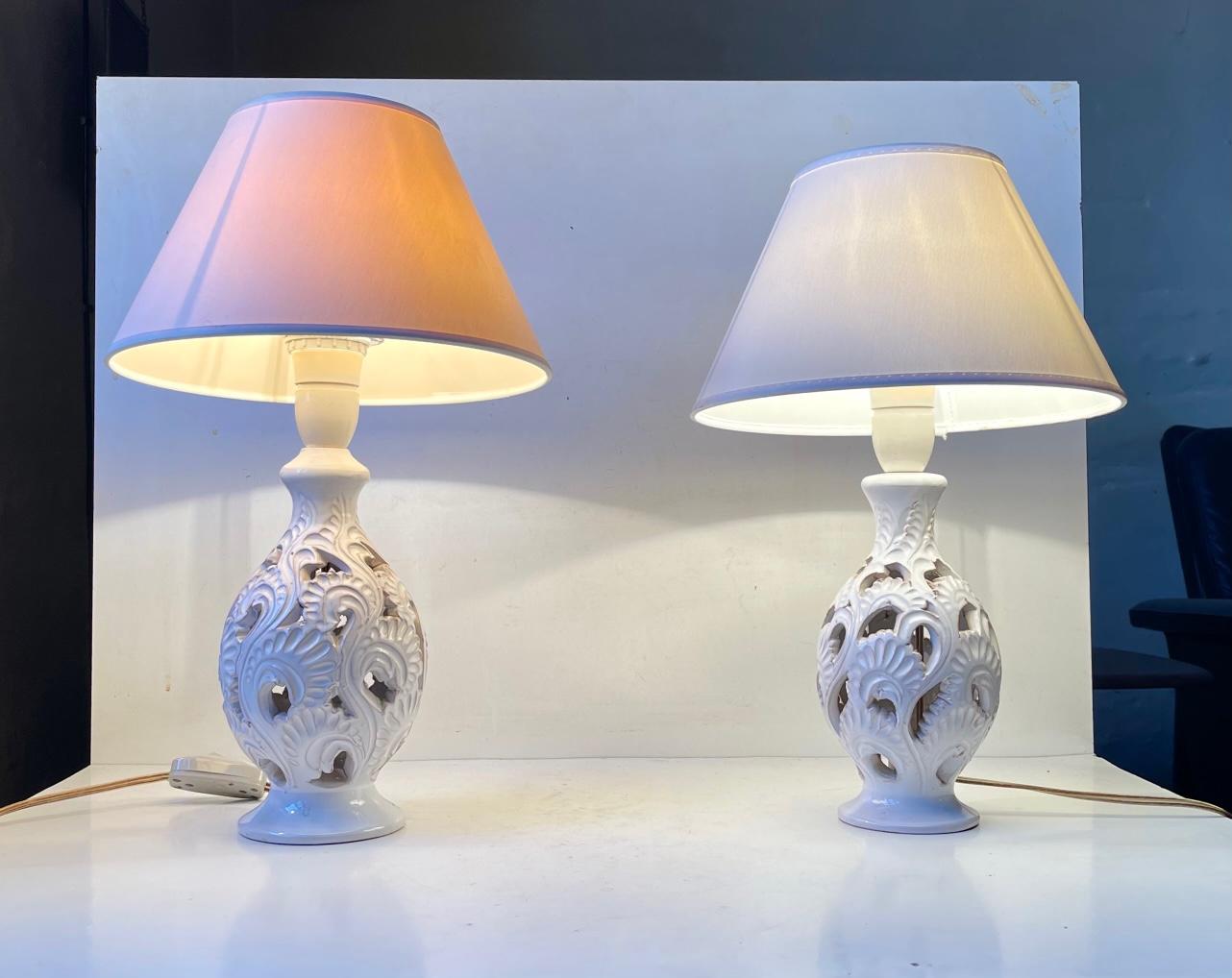A set of white glazed danish 1940s Table Lights with Floral impressions perforated to the pottery 'Body'. Arts and Craft - Art Nouveau styling. Both designed and manufactured by Hans Rudolf Petersen in Denmark during the late 1930s or early 40s.