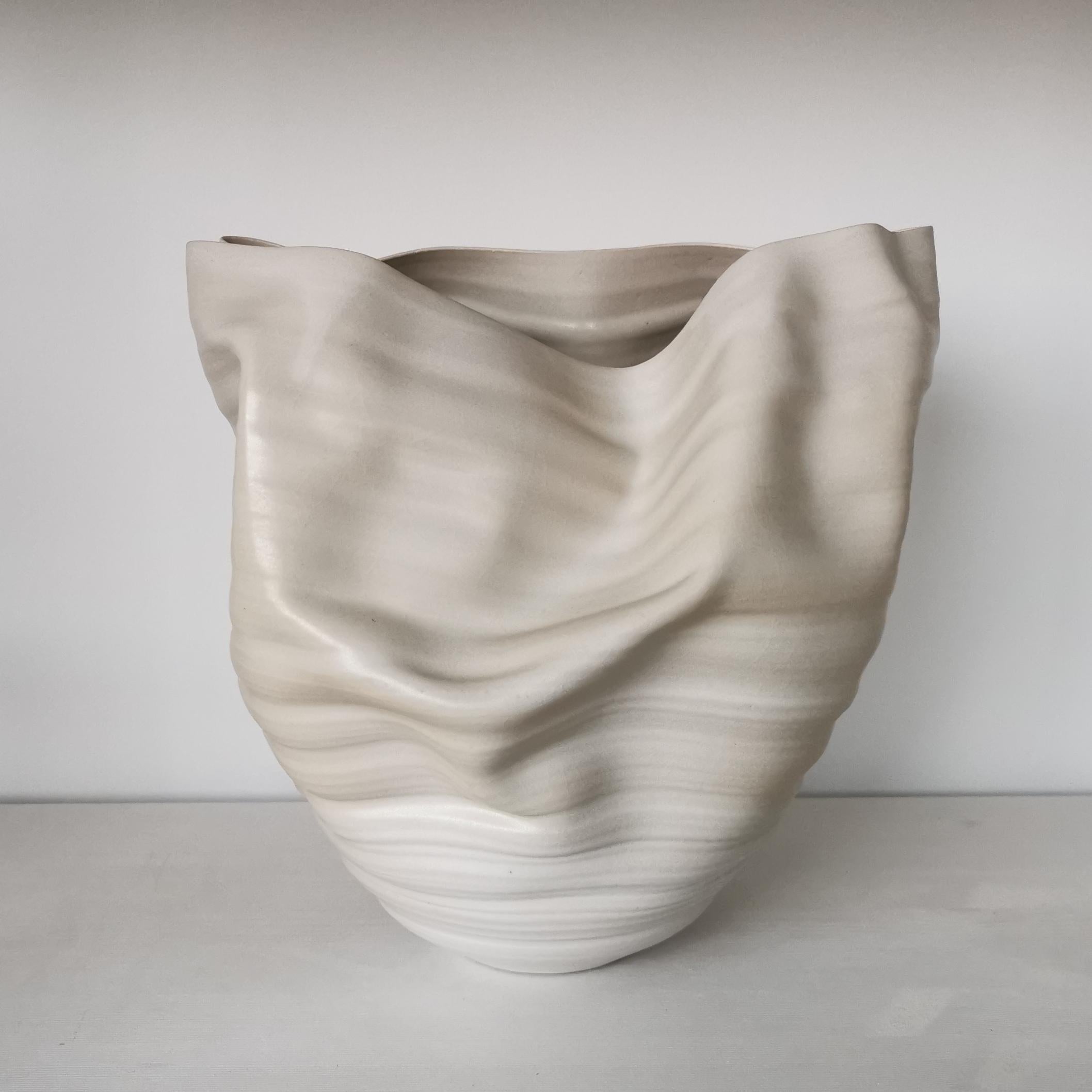 Sumptuous ceramic vessel from ceramic artist Nicholas Arroyave-Portela.
White Ribbed Undulating, Ceramic Sculpture or Vessel N.22.

White St.Thomas clay, Stoneware glazes, multi fired to cone 9 (1260 degrees).

Made in 2019.

Measures: 32 cm