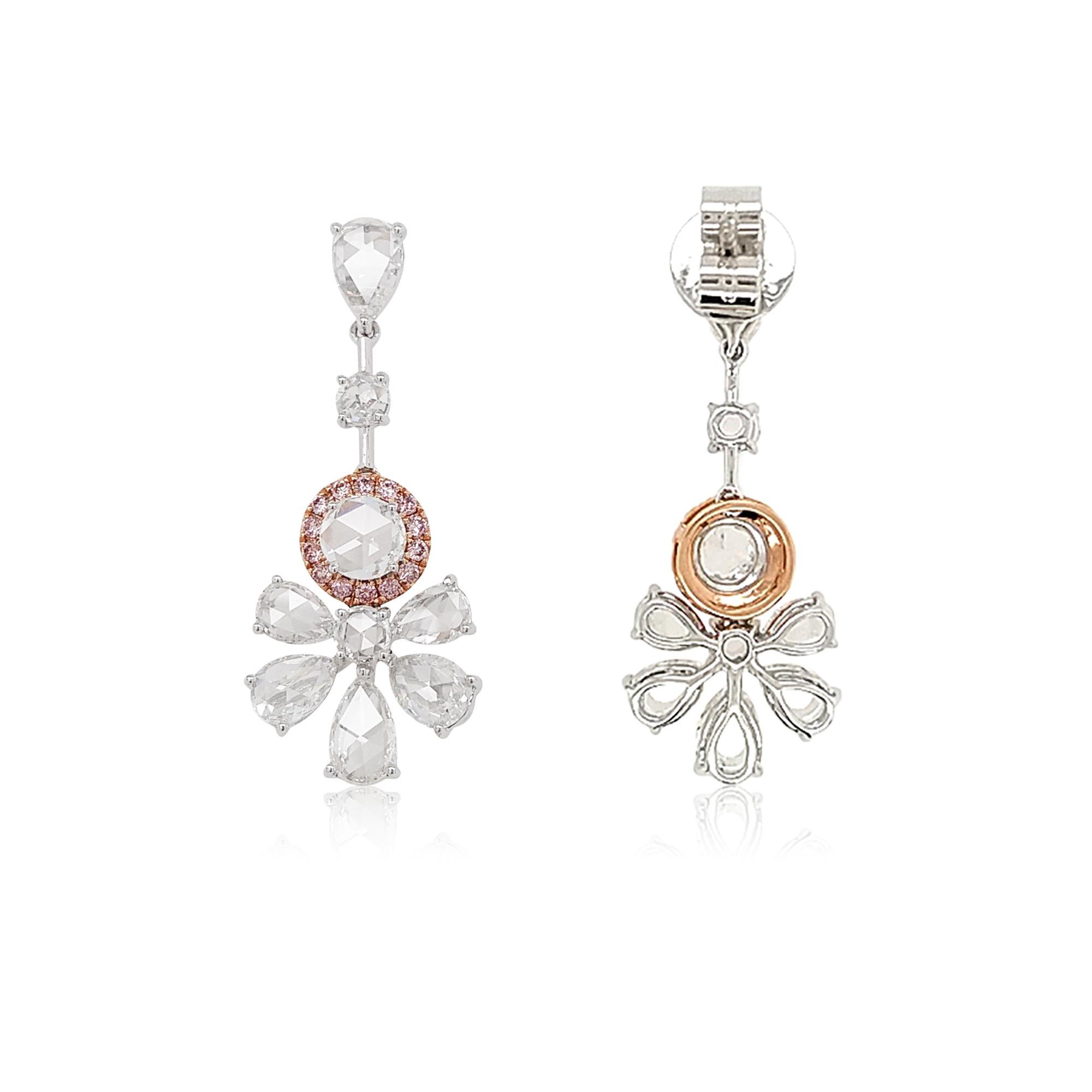 These flower-shaped diamond earrings present a charming look with white Rose-cut diamonds paired with Fancy Pink diamonds. A perfect set to grace your look for a fine Occasion.  
-	White Rose-cut diamonds - 4.59 carats 
-	Round Brilliant Cut Pink