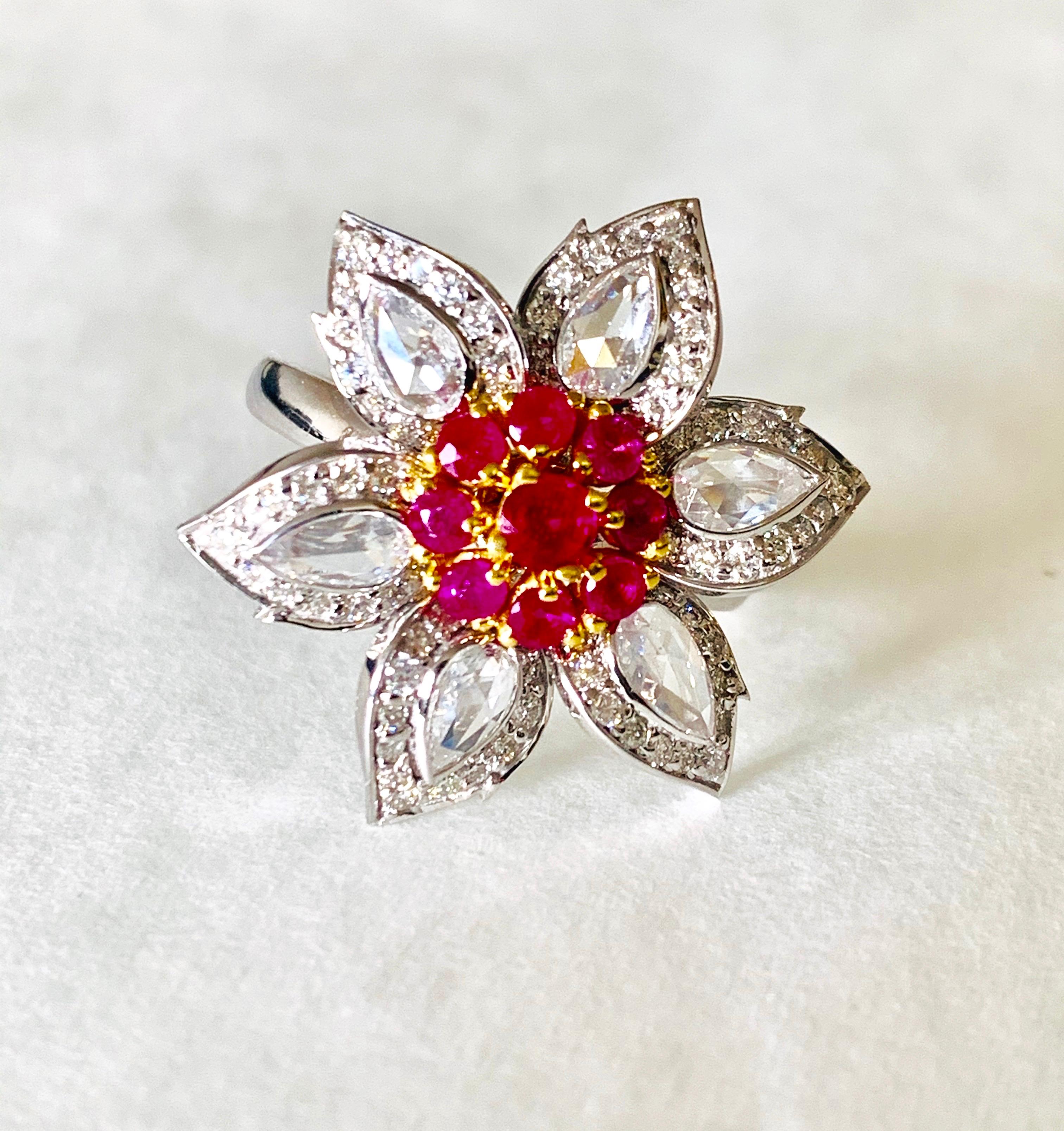 Moguldiam Inc's Rose cut diamond , round brilliant diamond and natural Burmese ruby engagement ring in handcrafted in 18 k white gold. 
The details are as follows : 
Rose cut diamond weight: 0.71 carat 
Round brilliant diamond weight ; 0.56 carat