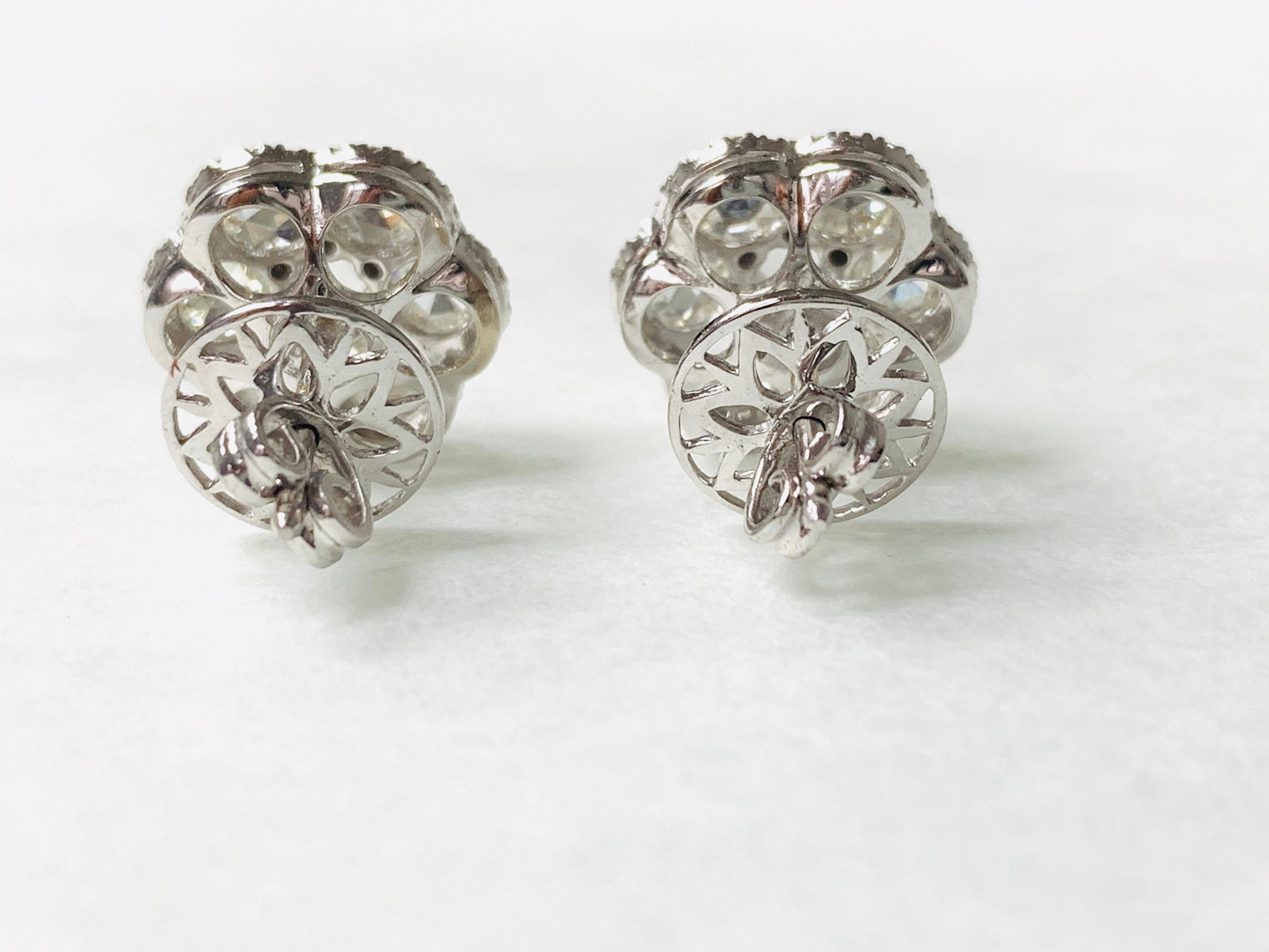 Moguldiam Inc White Rose Cut Diamond stud earrings in 18 k white gold. 
Rose Cut Diamond Weight : 2.46 carat 
White Small Diamonds : 0.39 carat 
Color and Clarity : GH color and VS clarity 
Metal : 18k white gold 