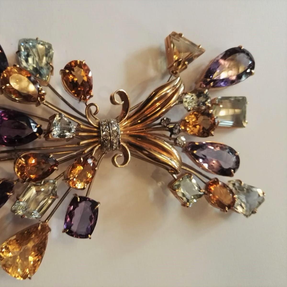 Multicolor brooch in 18kt rose and white gold with fancy cut stones and small diamond
Stones Details: 
Aquamarine abt. Carat 50.00
Amethyst abt. Carat 70.00
Quartz abt. Carat 50.00
Total weight: gr 87