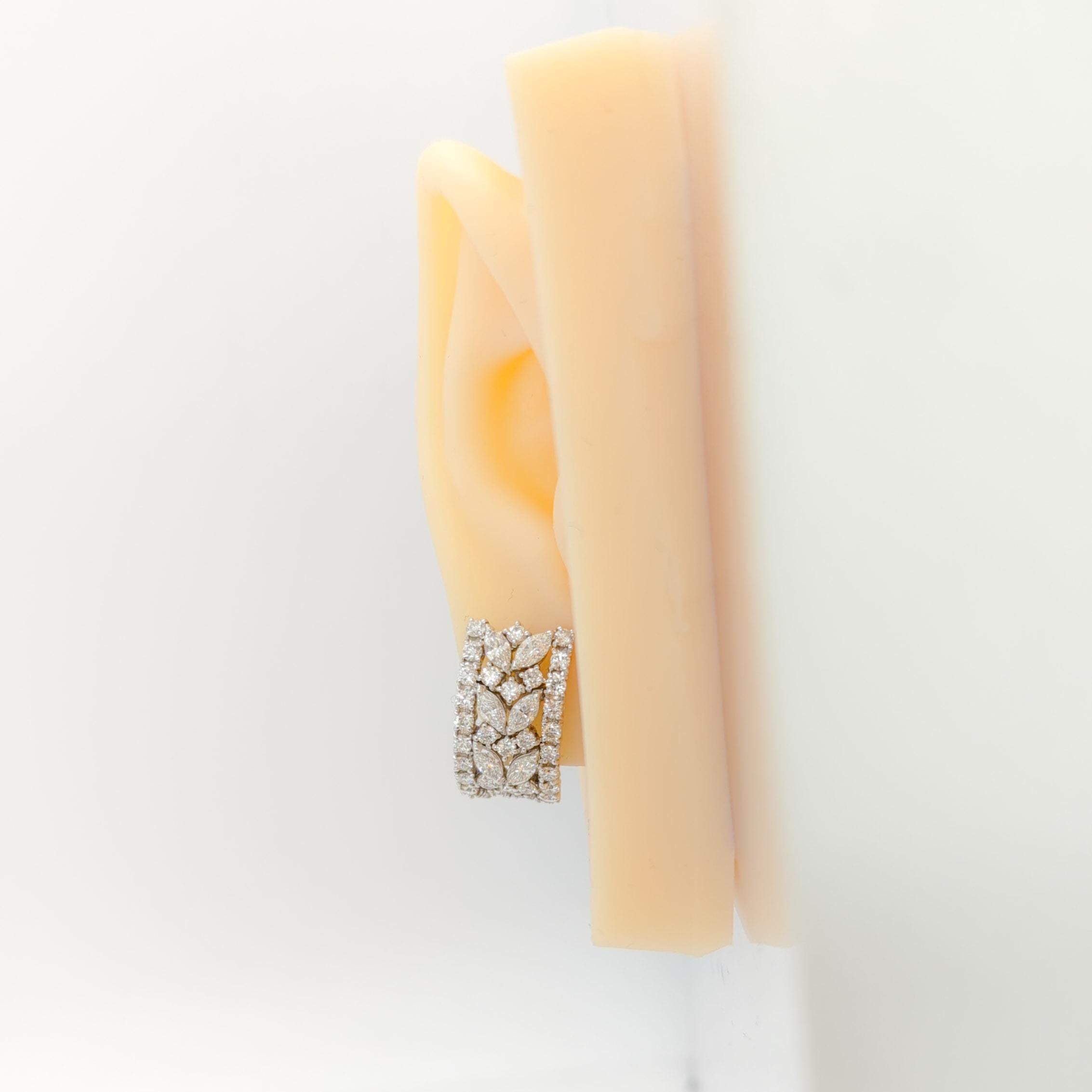 Beautiful semi hoop white diamond round and marquise shape earrings.  Handmade in 18k white gold.  Sophisticated and wearable, these earrings are a great addition to any collection.  Made in Italy.