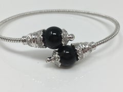 Bracelet souple en or blanc 18 carats avec brillants blancs et onyx