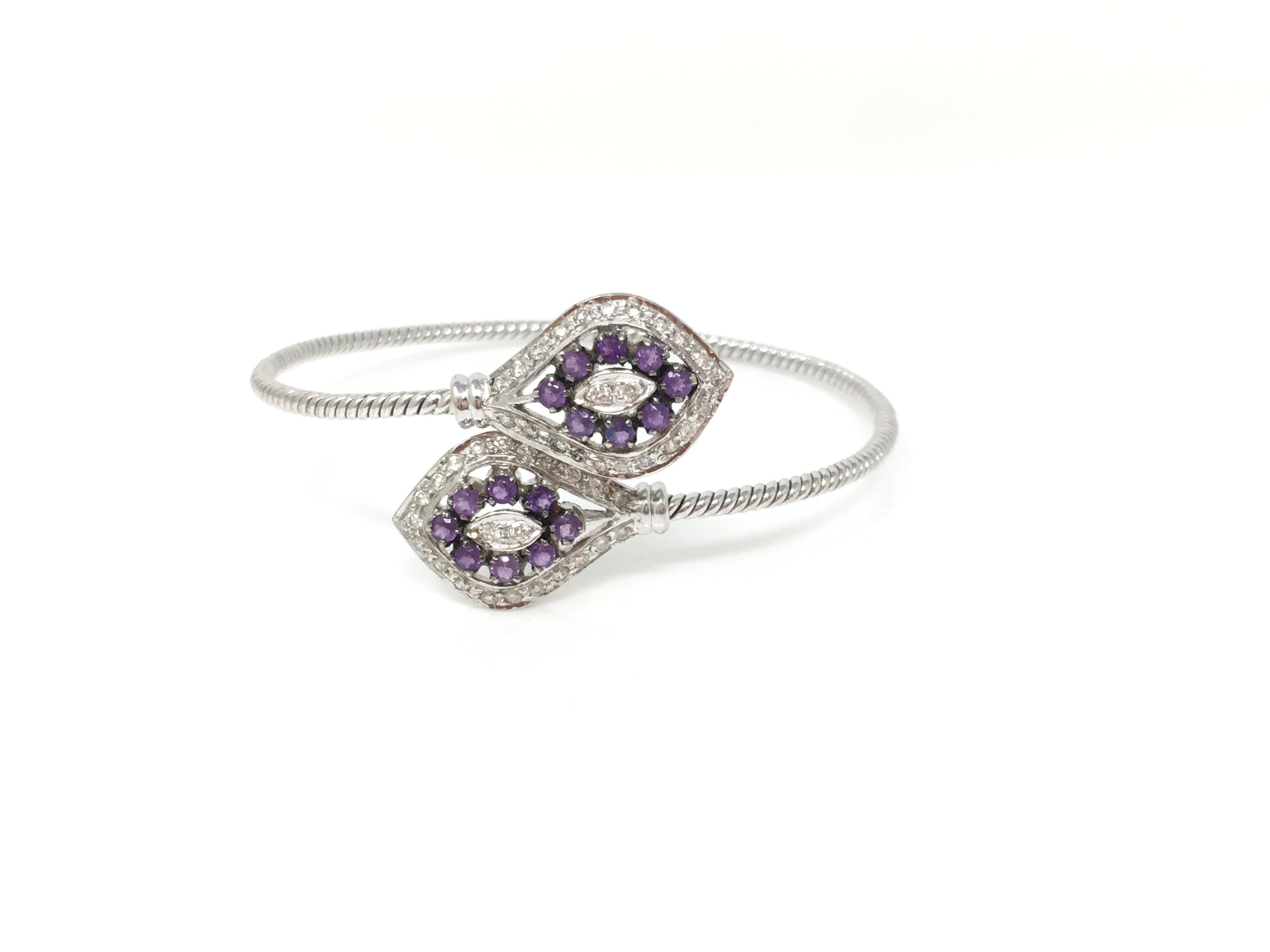 Flexible and adaptable bangle hand created by Moguldiam Inc in 18k white gold features white round brilliant diamonds weighing 0.44 carat ( GH color and VS clarity) and amethyst weighing 1.52 carat. The gold weighs 12.750 grams. The measurement of