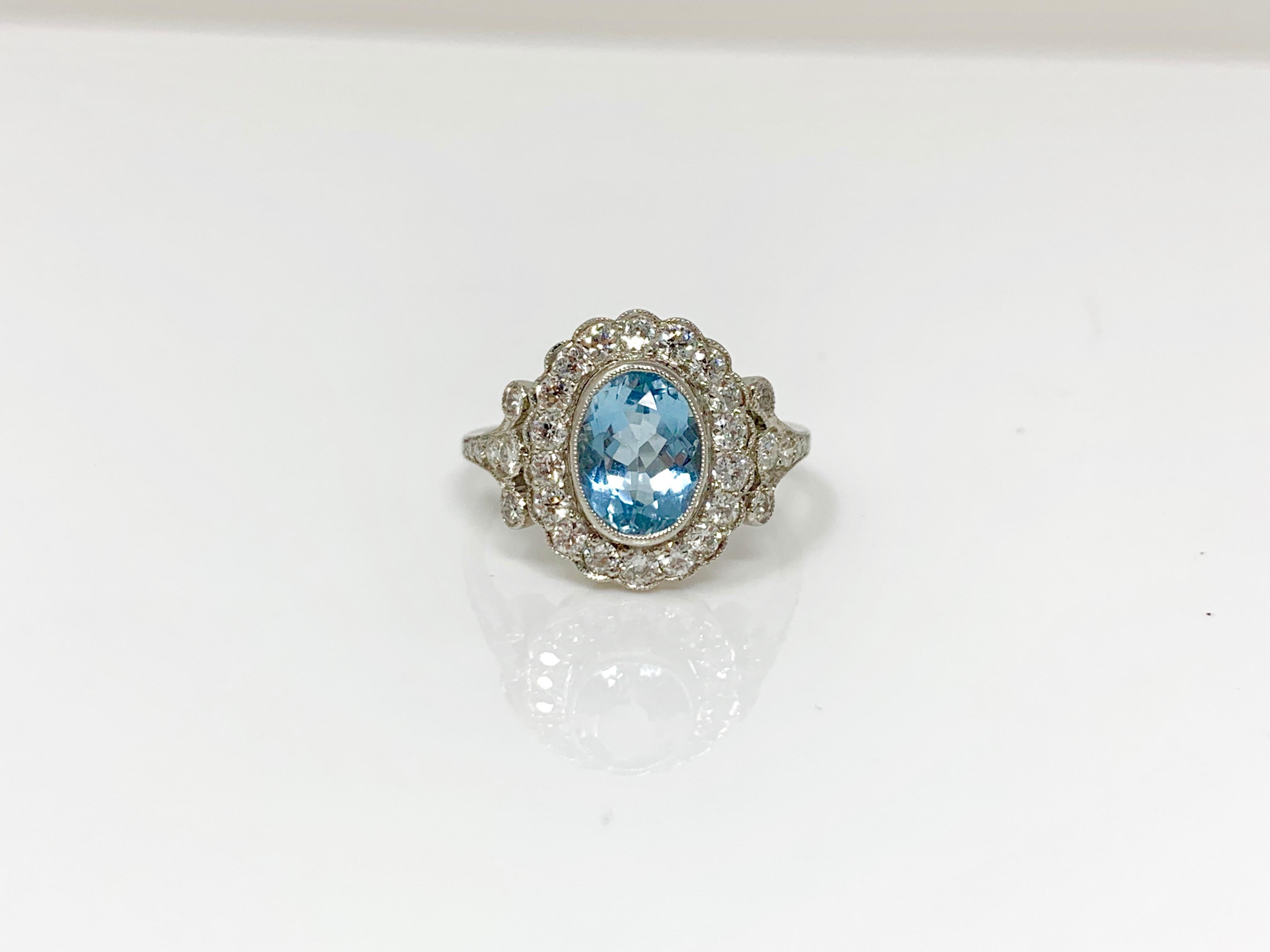 This gorgeous ring features aquamarine and white round brilliant diamond and is hand crafted in platinum. 
Aquamarine weight - 1.90 carat 
white diamond weight - 1.20 carat ( GH color and VS clarity) 
Metal - Platinum 
Ring Size - 7 1/2 ( can be
