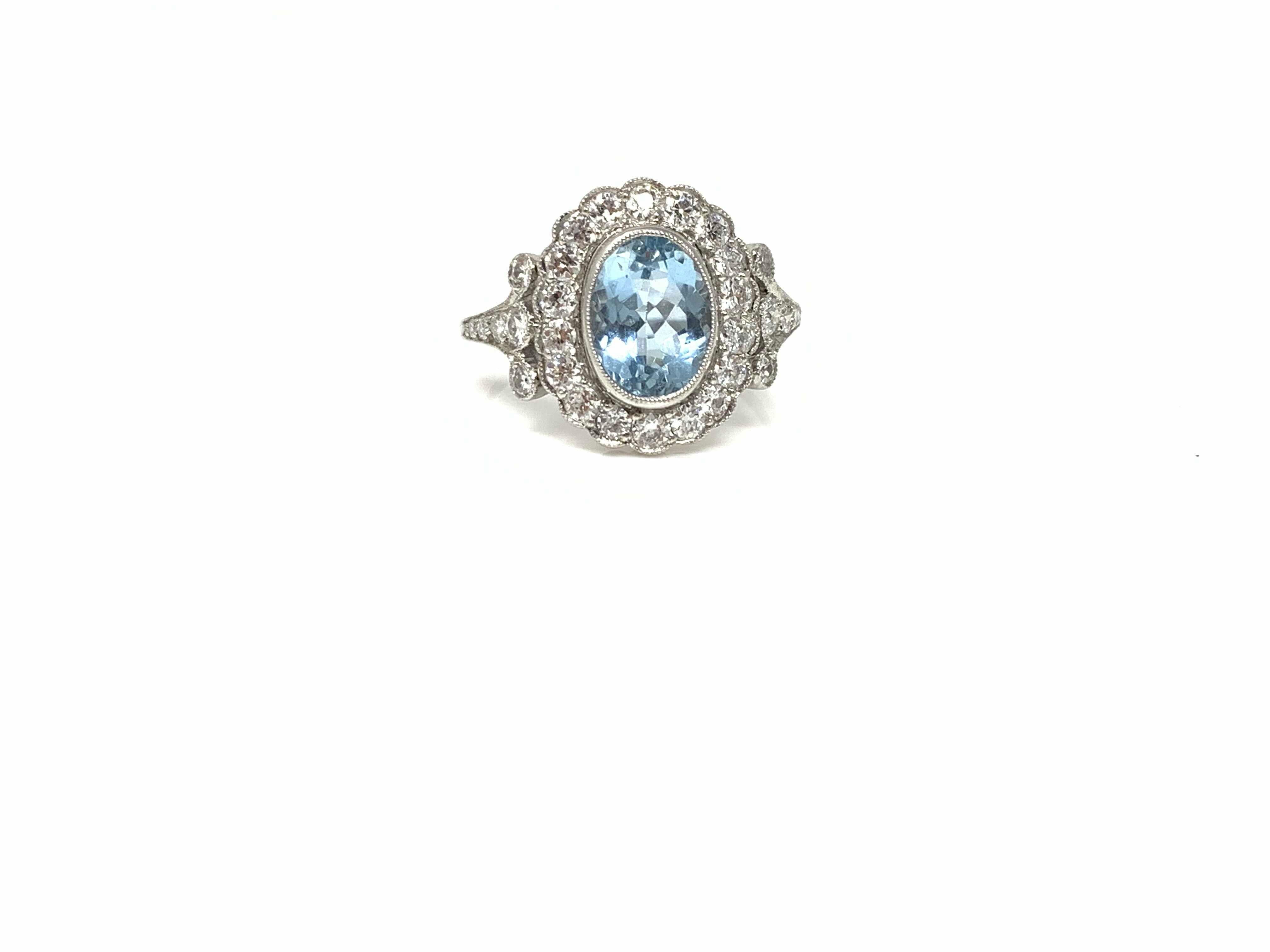 Oval Cut White Round Brilliant Diamond and Aquamarine Ring in Platinum