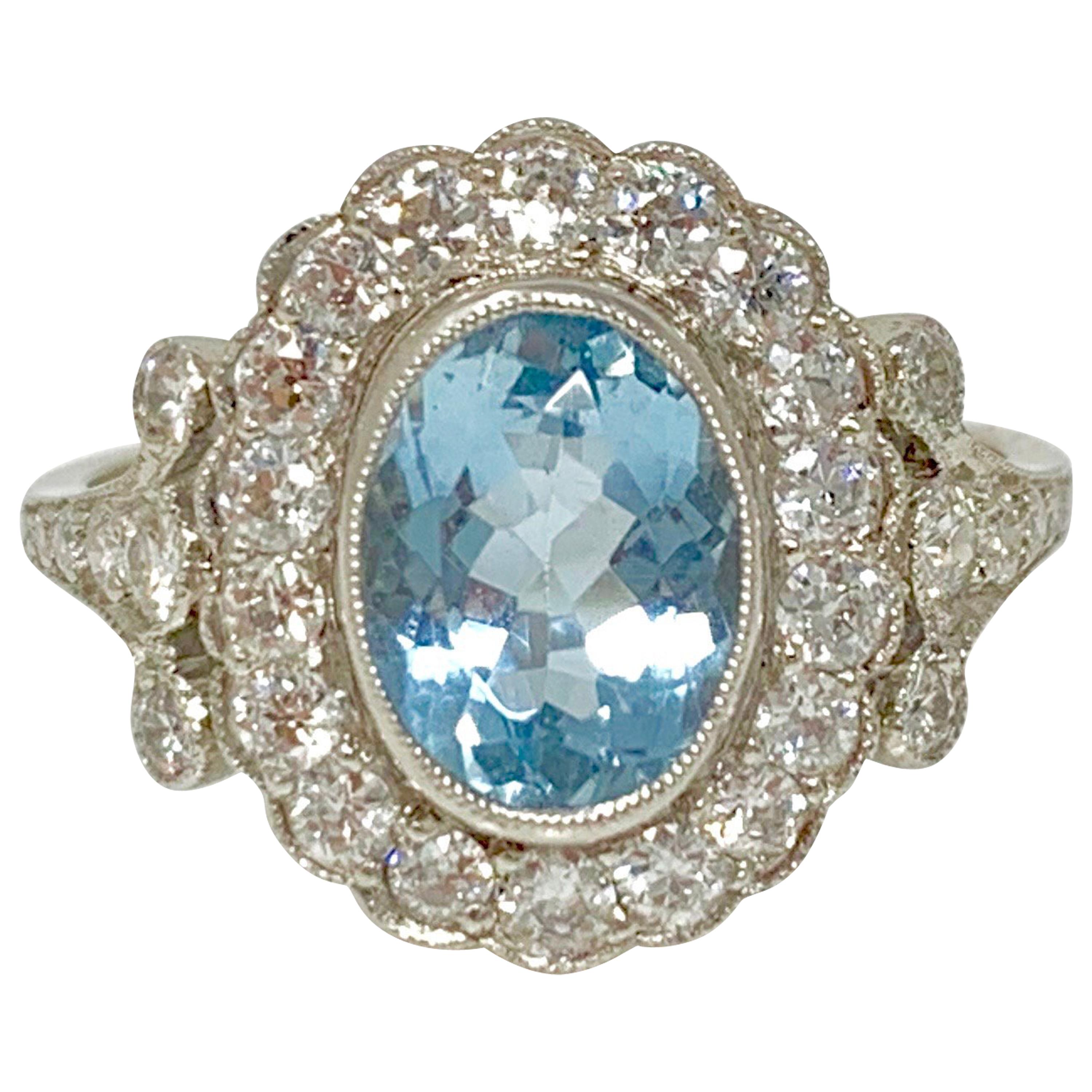 White Round Brilliant Diamond and Aquamarine Ring in Platinum
