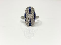 Ring aus Platin mit weißem weißen runden Brillanten und blauem Saphir