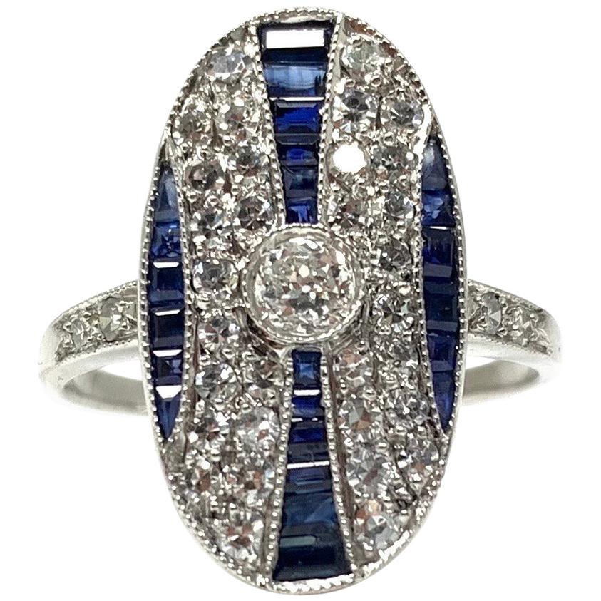 Ring aus Platin mit weißem weißen runden Brillanten und blauem Saphir