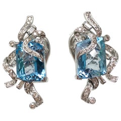 White Round Brilliant Diamond and Blue Topaz Earring Studs in 18 Karat Gold