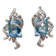 White Round Brilliant Diamond And Blue Topaz Earring Studs In 18K White Gold