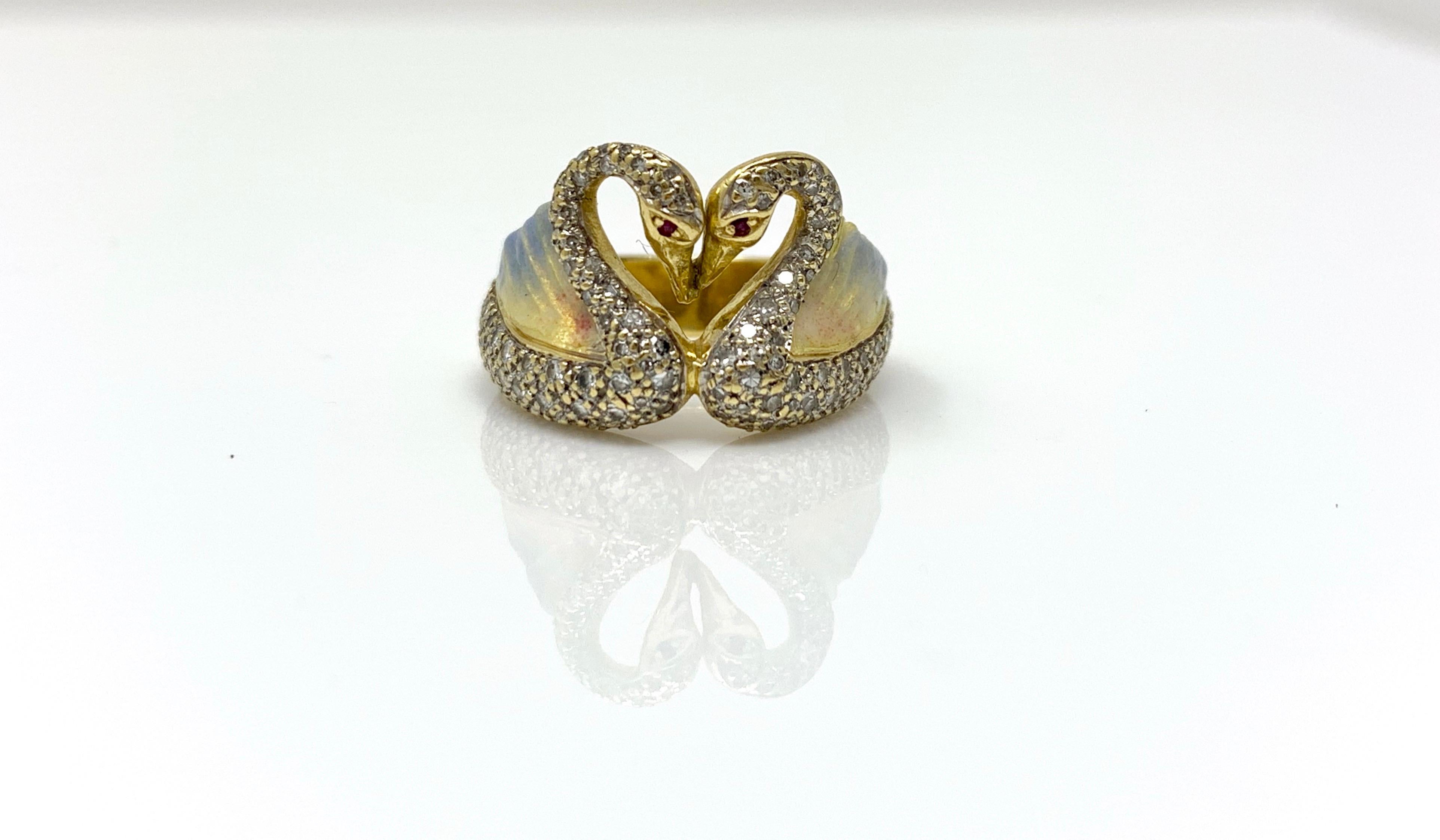 This gorgeous and one of a kind white round brilliant diamond and enamel ring is a symbol of love. Two swans together making a heart in the center. The swans are beautifully pave set with diamonds weighing 1.20 carat approximately with GH color and