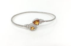 White Round Brilliant Diamond And Gold Topaz Flexible Bangle In 18 K White Gold.