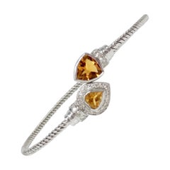 White Round Brilliant Diamond And Gold Topaz Flexible Bangle In 18 K White Gold.