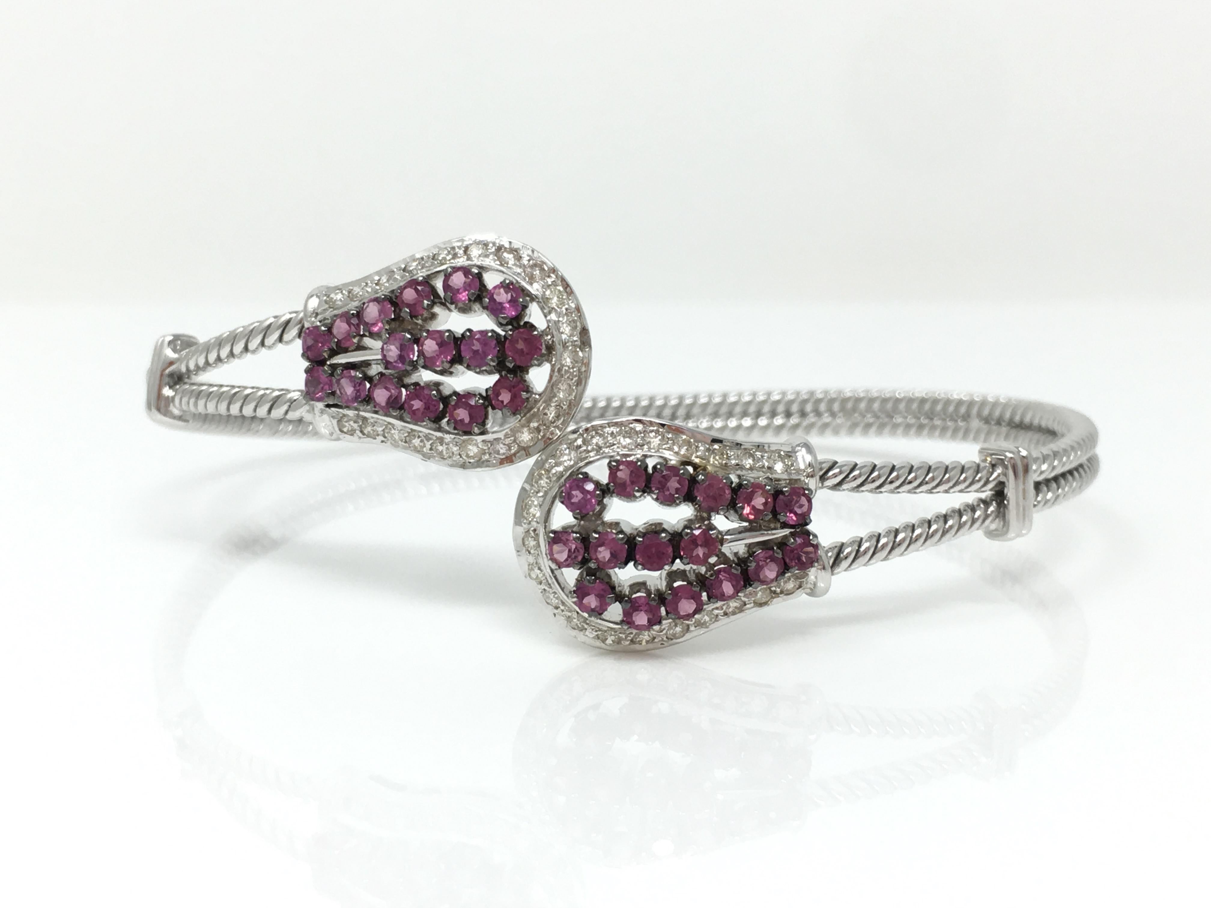 This beautifully hand made white round brilliant diamond and rubellite 18k white gold bangle is flexible and is adaptable to most wrist sizes. The white round brilliant diamond weighs 0.44 carat and rubelite weighs 1.52 carat. The gold weight is