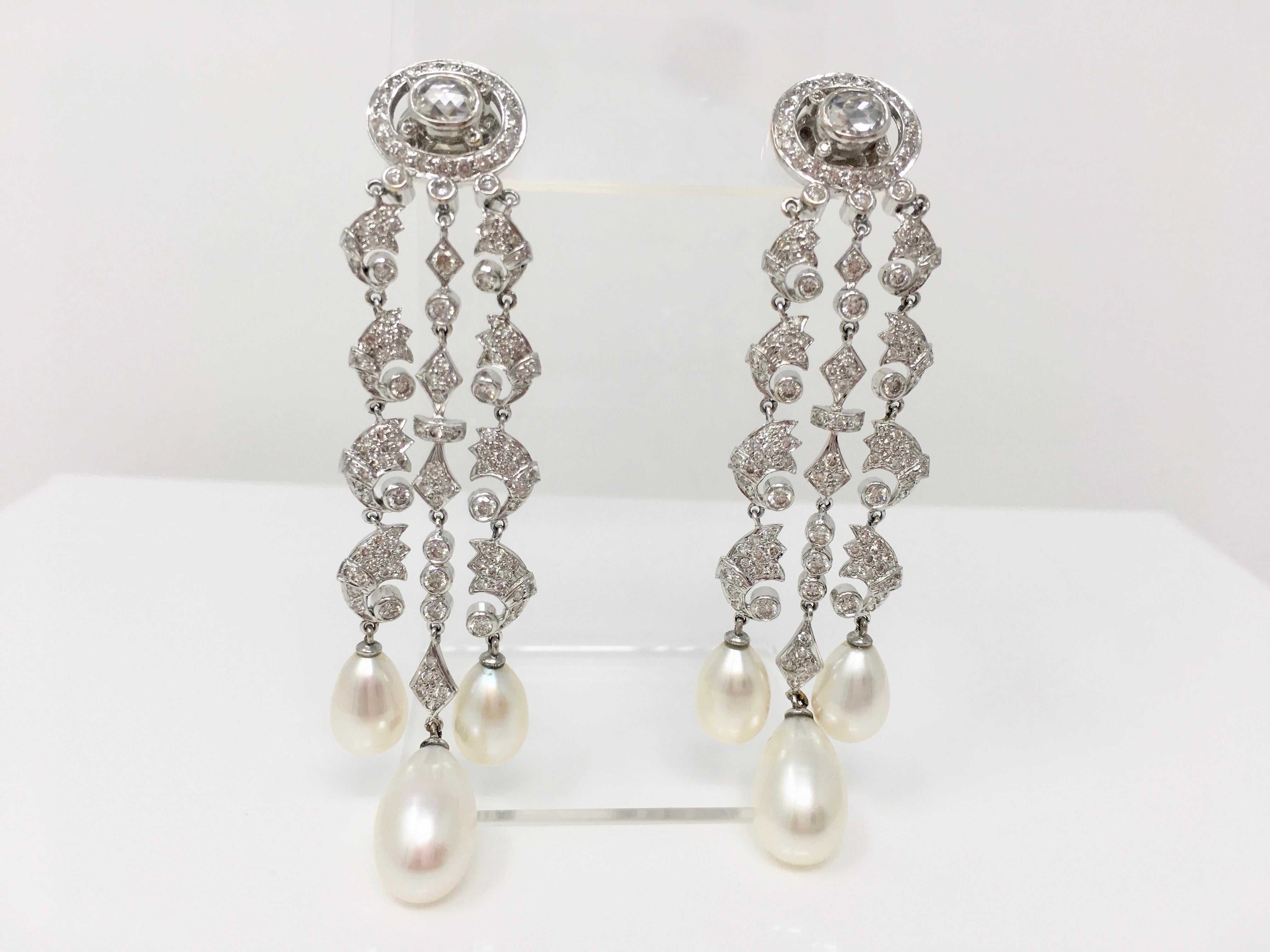 Gorgeous 18 k white gold chandelier earrings featuring 6 Carats approx of white round brilliant diamonds with VS clarity GH color and 6 south sea pearls with beautiful lusture  . The measurements of the earring is 3.50 inches in length. These