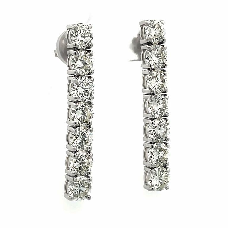 This earring is designed for women who want to be fashionable on any occasion. It is a pair of earrings made of 14K white gold with fourteen diamonds of 0.50 pointer each with a total of 7.52-carat weight. This design is modern and fashionable and