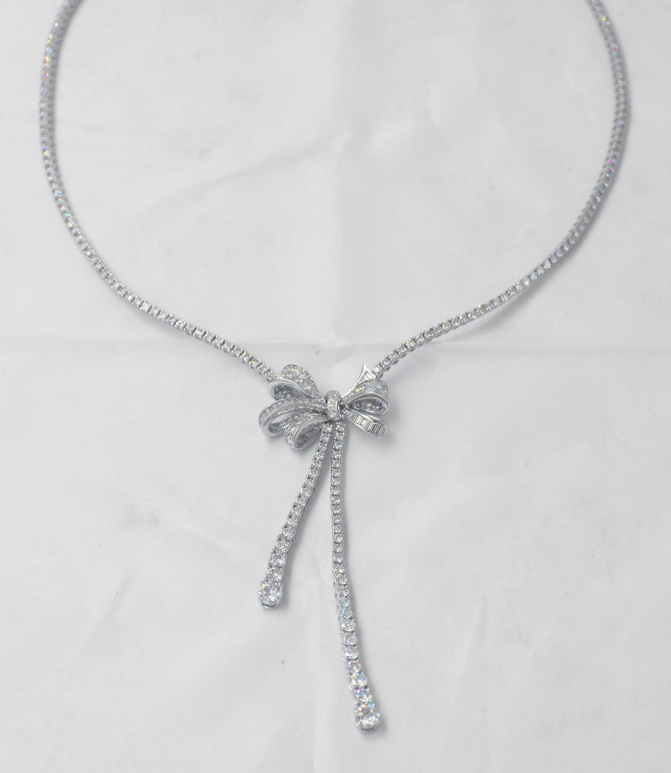 Bow Round Drop Necklace with Diamond.
27 Baguette Diamond Weighing : 0.57 cts
285 Round Diaonds Weighing: 878 cts
Total: Diamond Weight : 9.35 cts
Come with Pouch and Certificate.
Reference Number : RGN461