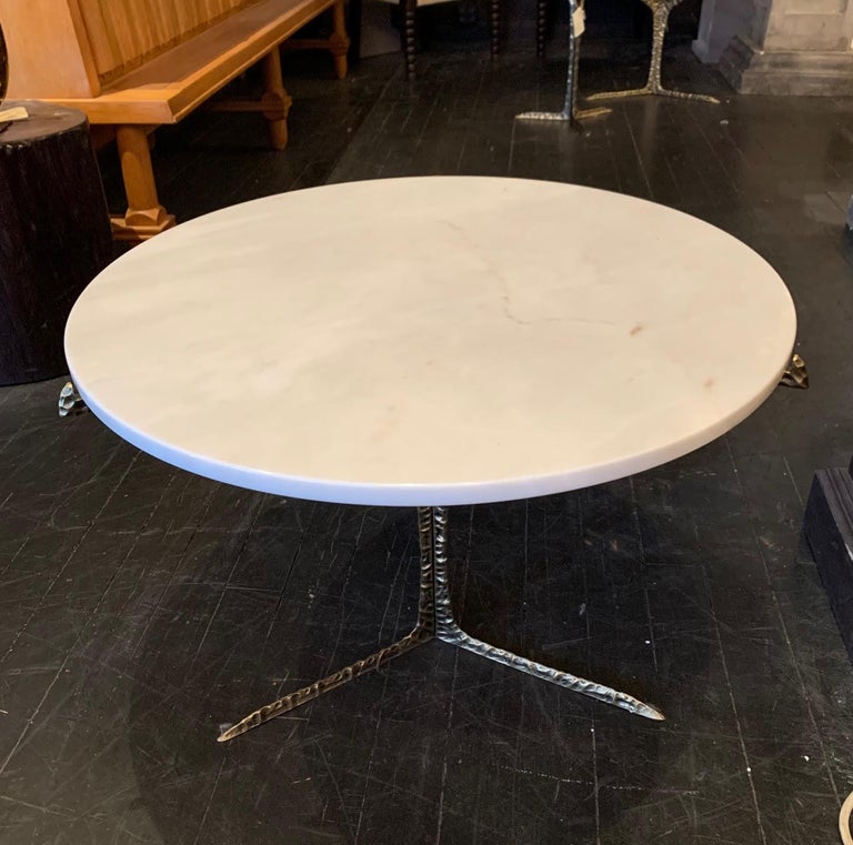 Thick round marble top coffee table
Hammered brass tripod legs
Also available with a lucite top (F2620).