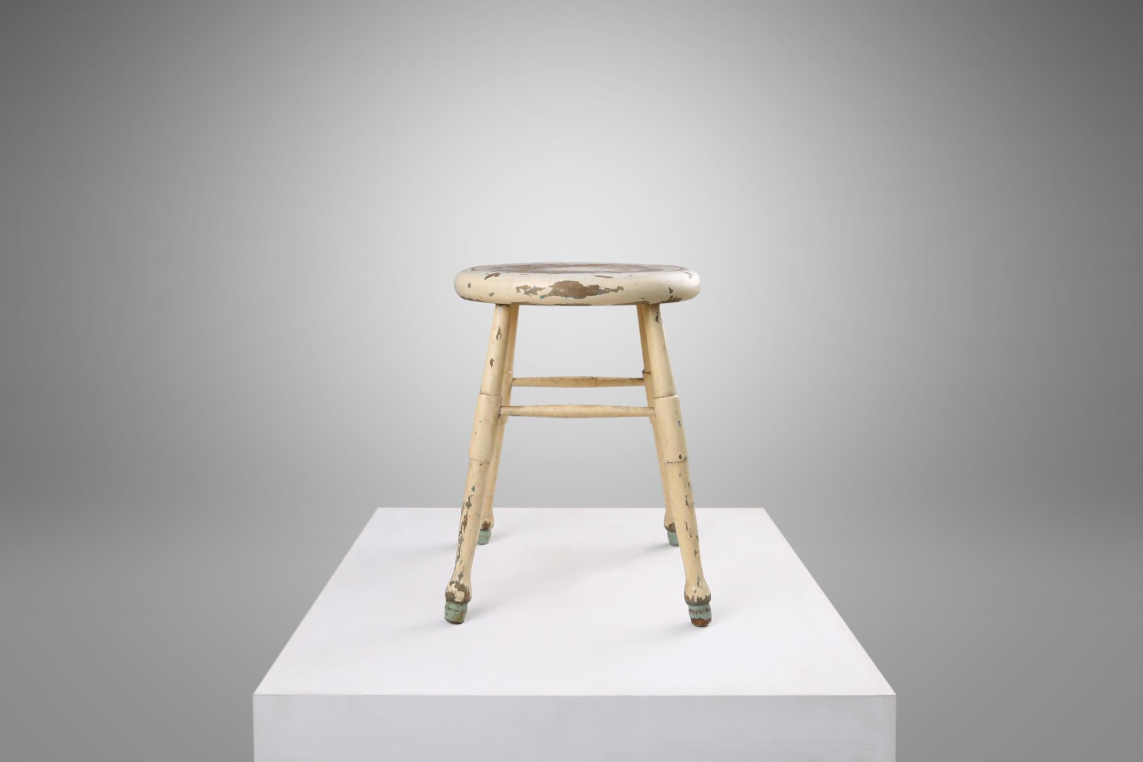 Belgian white painted stool with some great patina on the wood and paint. made around 1930.