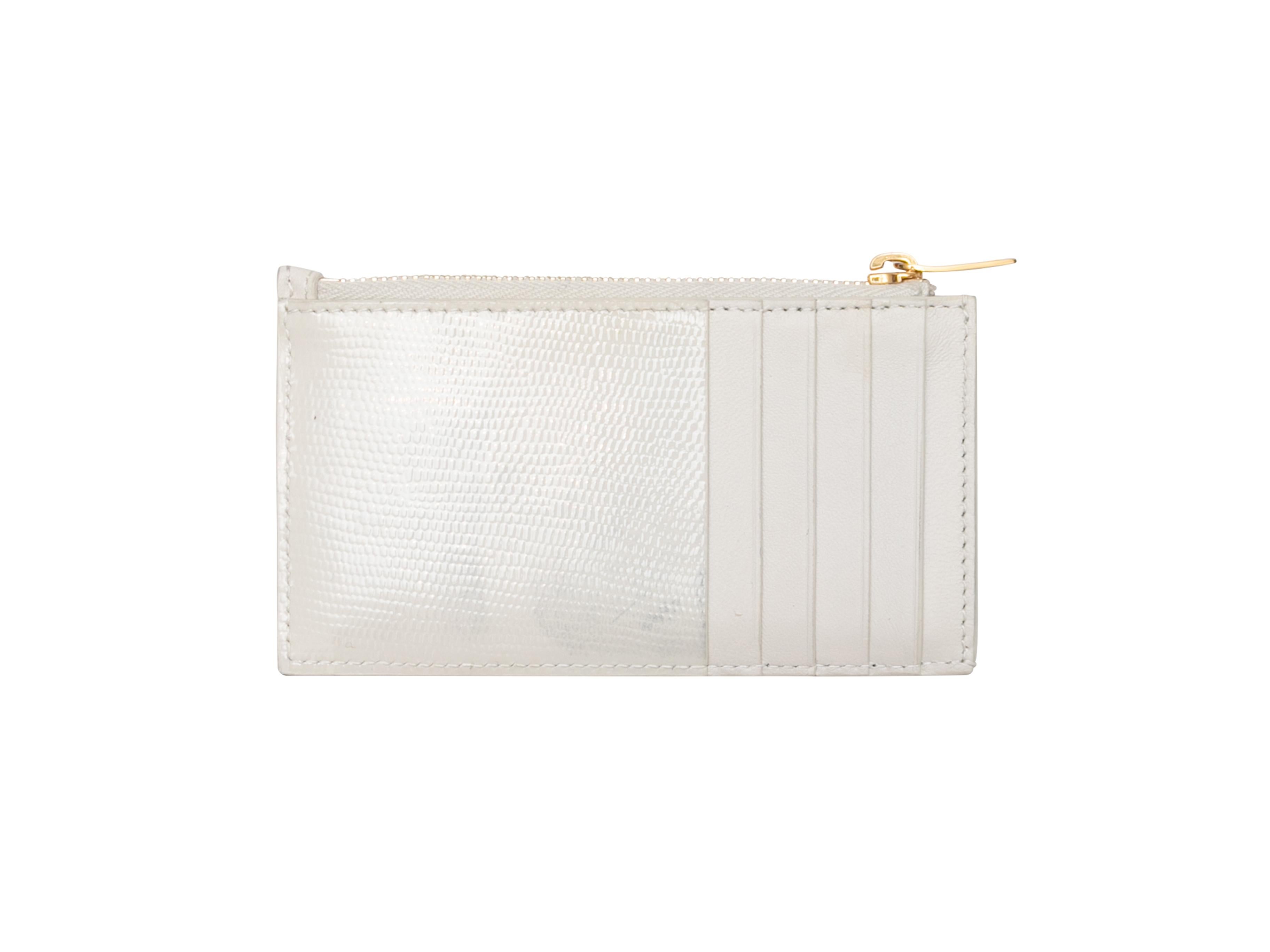 White leather card holder wallet by Saint Laurent. Gold-tone hardware. Exterior back card slots. Top zip closure. 3