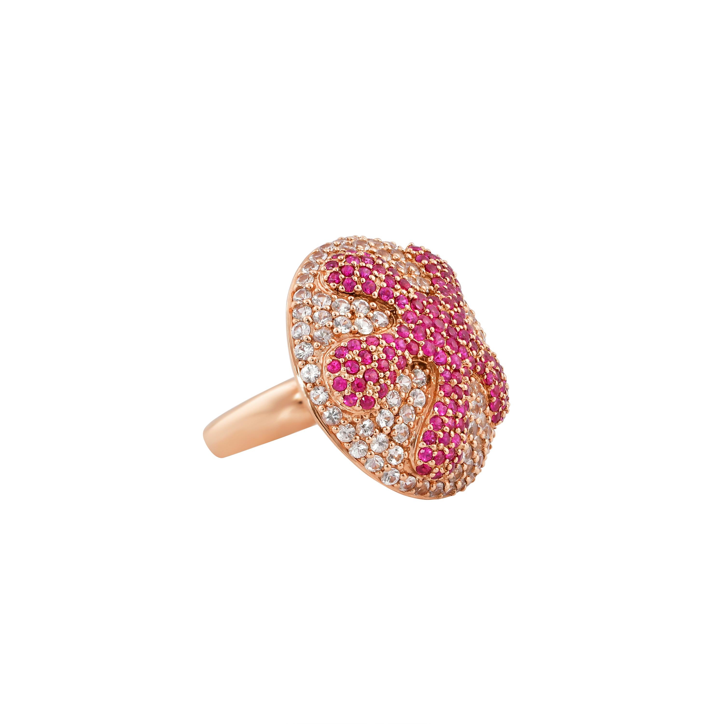 Go under the sea with this unique cocktail ring. This ring incorporates a unique pairing of color gems that are pave set to illustrate a starfish on the sea bed.  

Fancy white sapphire and ruby ring in 14K rose gold.

White Sapphire: 1.99 carat