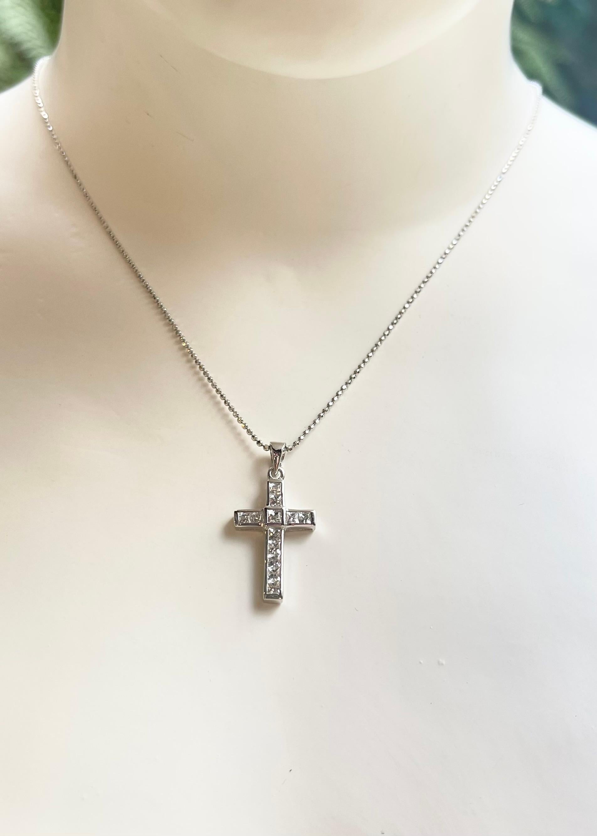 White Sapphire 0.82 carat Cross Pendant set in 18K White Gold Settings
(chain not included)

Width: 1.3 cm 
Length: 2.7 cm
Total Weight: 2.36 grams


