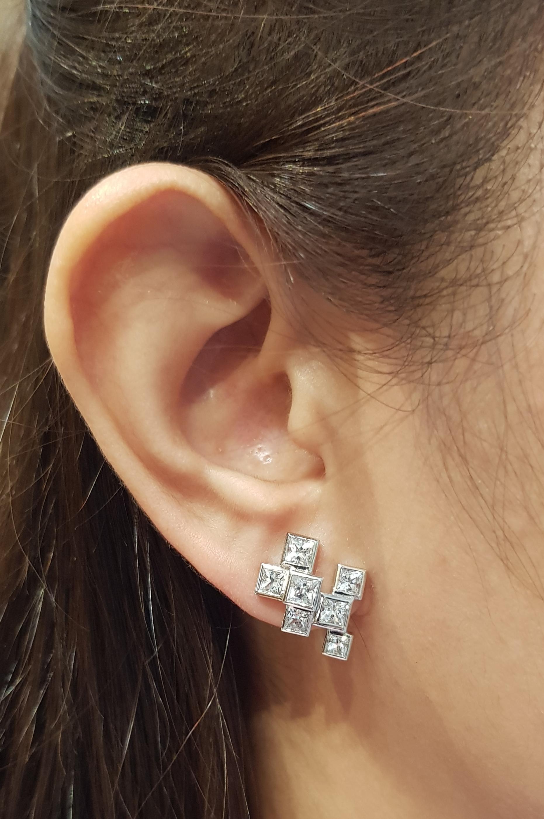 White Sapphire 2.99 carats Earrings set in 18 Karat White Gold Settings

Width:  1.5 cm 
Length: 1.9 cm
Total Weight: 9.14 grams

