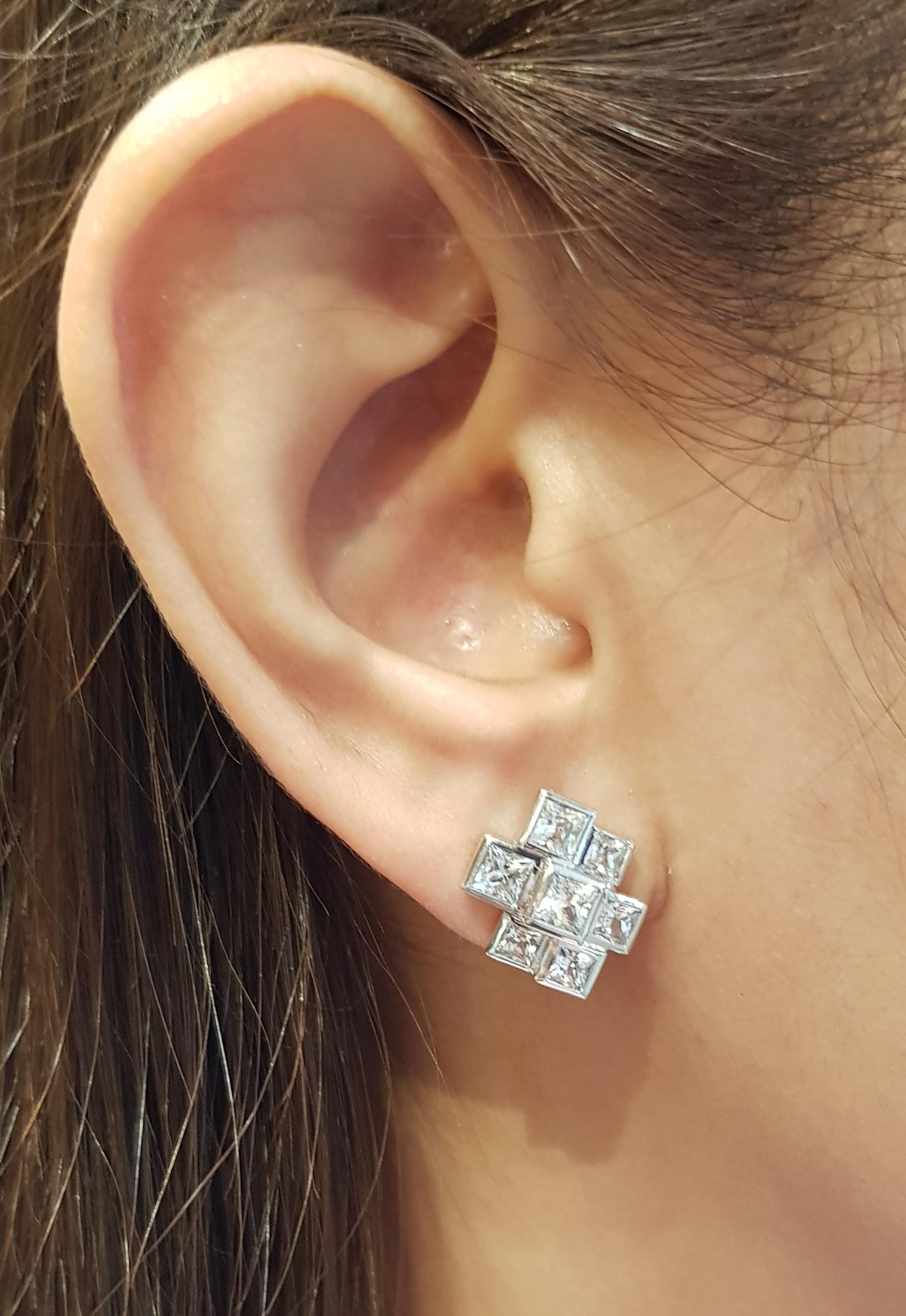 White Sapphire 2.96 carats Earrings set in 18 Karat White Gold Settings

Width:  1.3 cm 
Length: 1.6 cm
Total Weight: 9.29 grams

