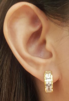 White Sapphire Huggies Earrings set in 18 Karat Gold Settings