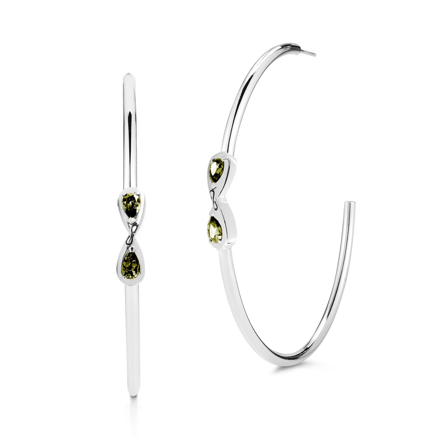 Designed in NYC

.925 Sterling Silver 6 x 4 mm White Topaz Large Infinity With Stone Open Hoops. When it comes to self-expression, the style possibilities are endless. Large Infinity with stone open hoops:

Sterling silver 
High-polish