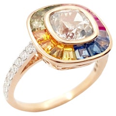 Zafiro blanco, zafiro color arco iris y anillo de diamantes engastados en oro rosa de 18 quilates