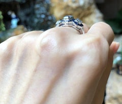 White Sapphire with Blue Sapphire and Diamond Ring Set in 18 Karat White Gold