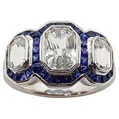 White Sapphire with Blue Sapphire and Diamond Ring Set in 18 Karat White Gold