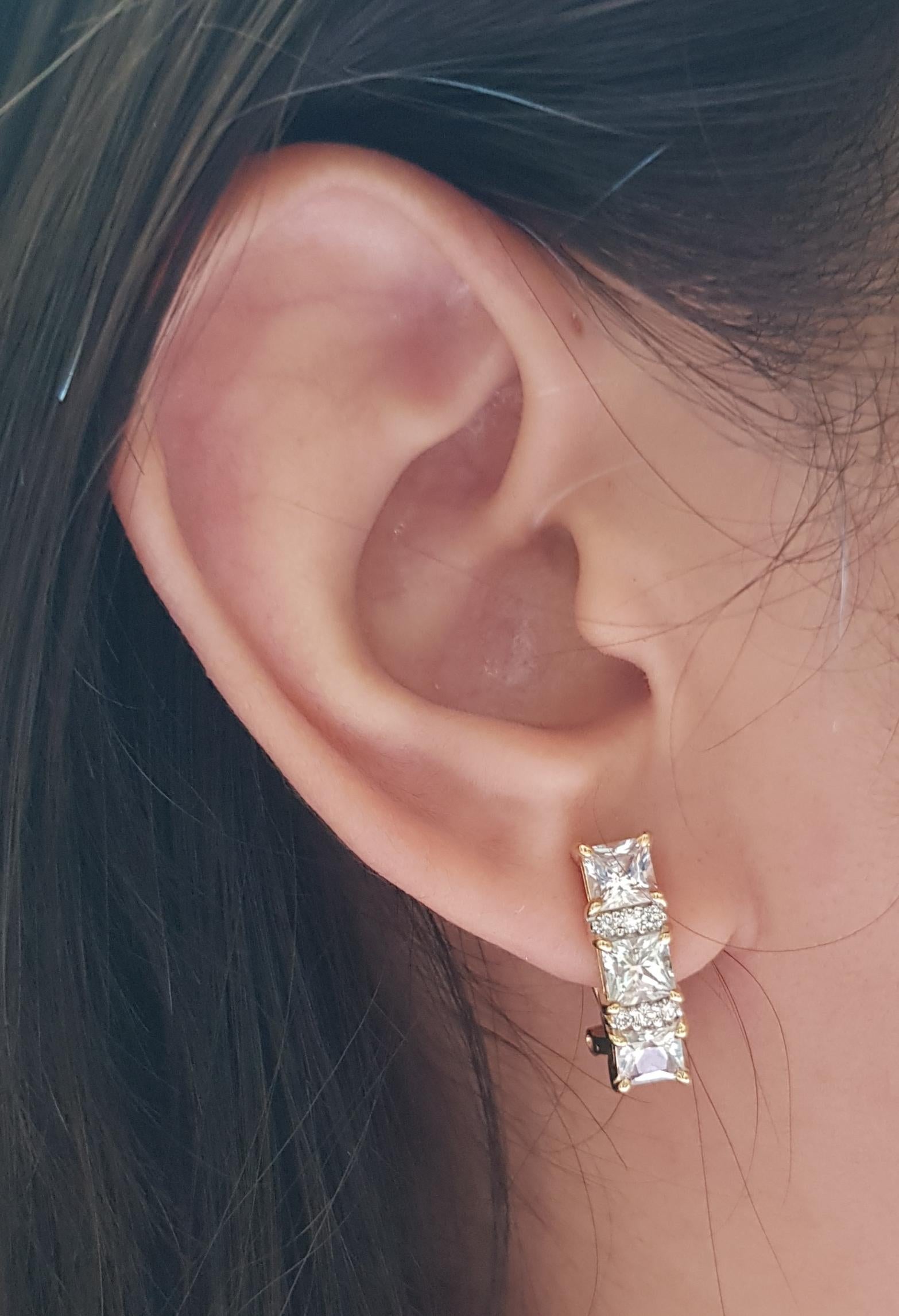 White Sapphire 3.61 carats with Diamond 0.19 carat Earrings set in 18 Karat Gold Settings

Width:  0.5 cm 
Length: 1.8 cm
Total Weight: 7.79 grams

