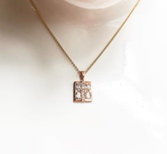White Sapphire with Diamond Pendant Set in 18 Karat Rose Gold Settings