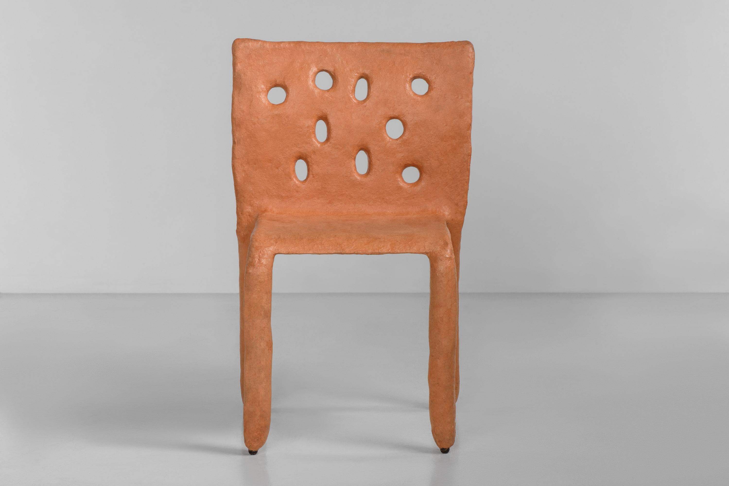 Sculpted Outdoor contemporary chair by Faina.
Design: Victoriya Yakusha.
Material: steel, flax rubber, biopolymer, cellulose.
Dimensions: height 82 x width 54 x legs depth 45 cm.
 Weight: 15 kilos.

Made in the style of ethnic minimalism, the