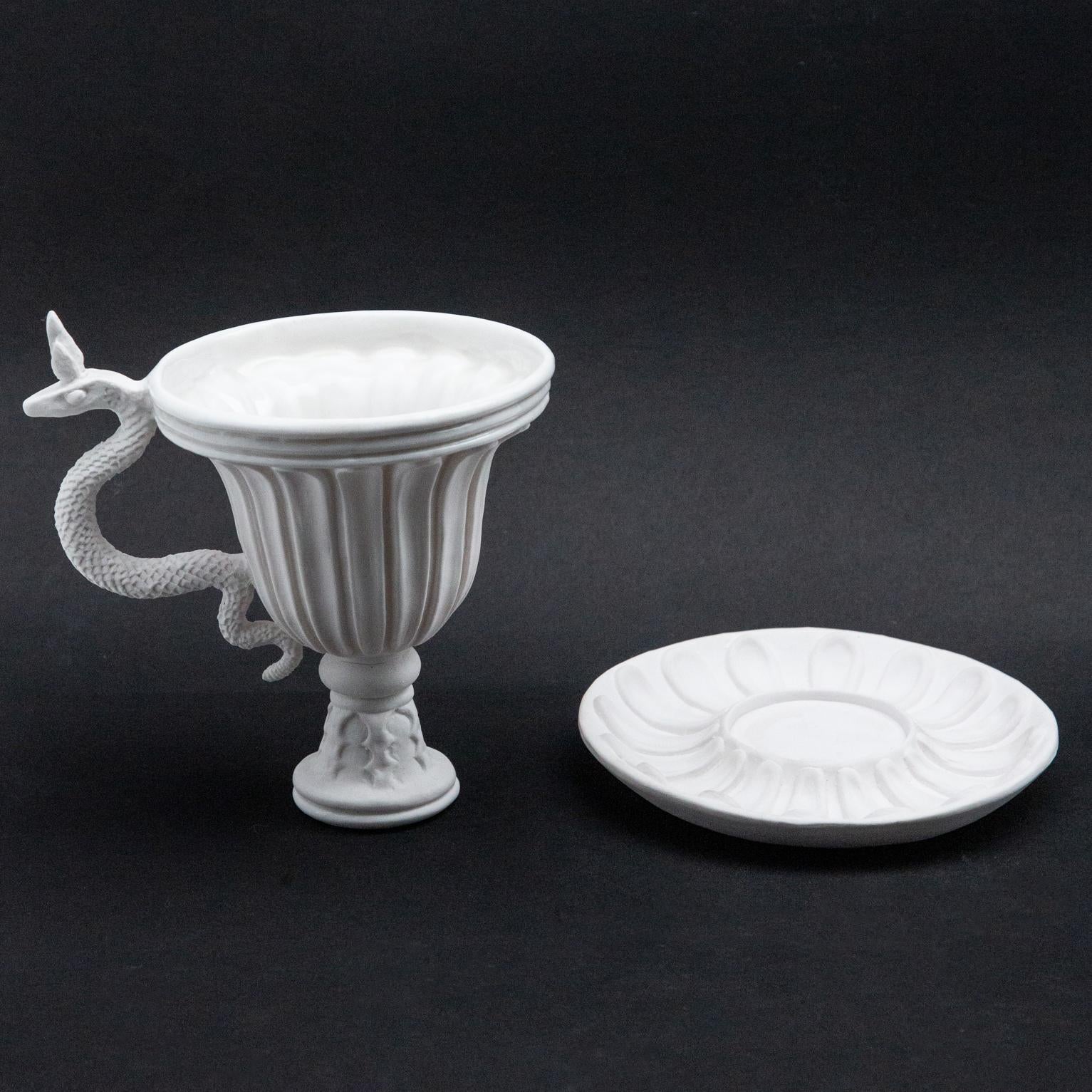 White serpent chalice and saucer, Oriel Harwood. Harwood is a ceramicist and artist who is represented by David Gill galleries and creates fantastic and mystical ceramic objects, furniture, and sculpture. This particular piece is glazed inside the