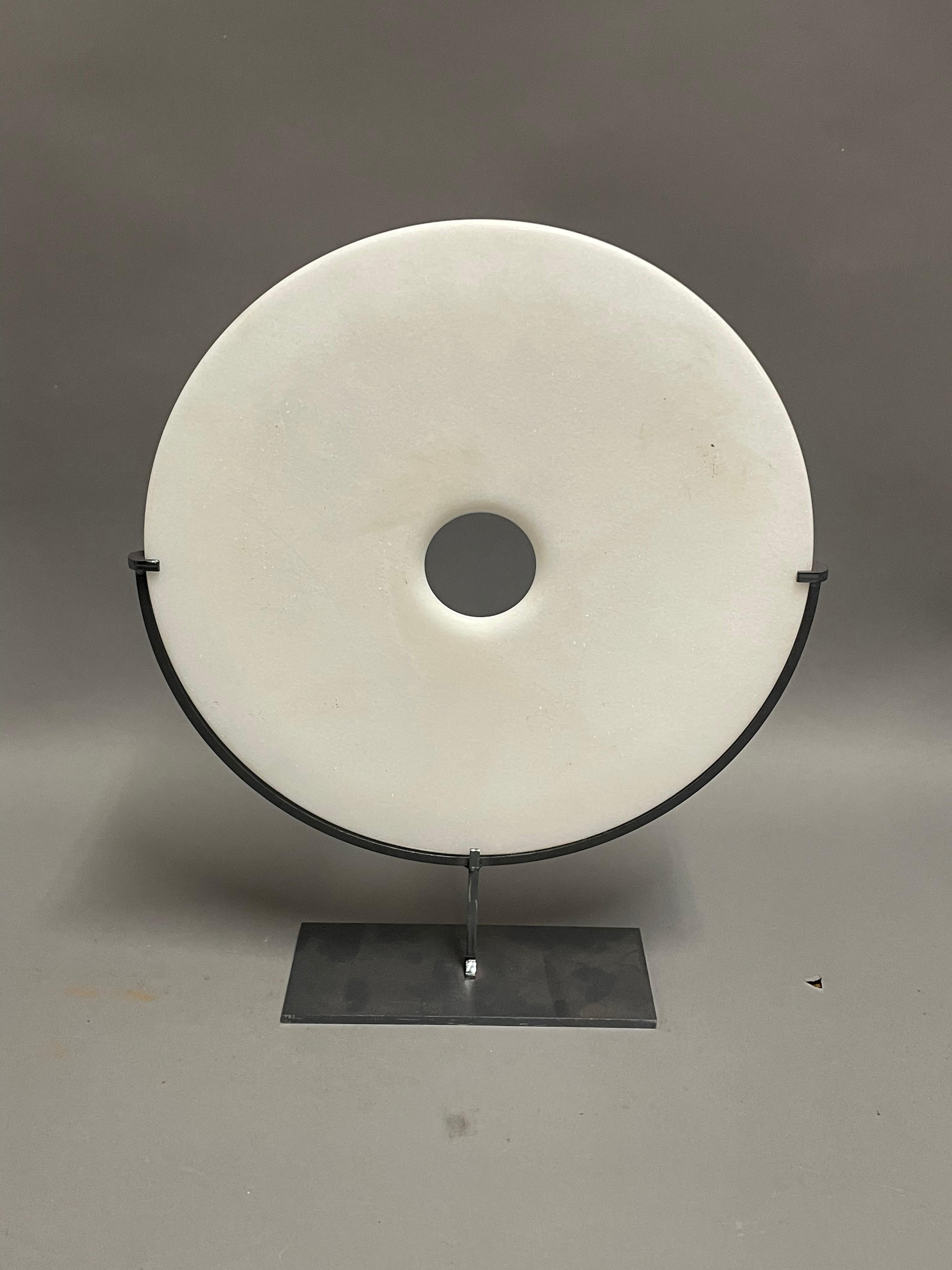 Contemporary Chinese set of three smooth white jade discs.
One disc measures  12d   x  15h       stand measures  7  x  3.5
One disc measures   10d  x  12.5h    stand measures  6  x  3
One disc measures      8d  x  11h        stand measures  5 x  